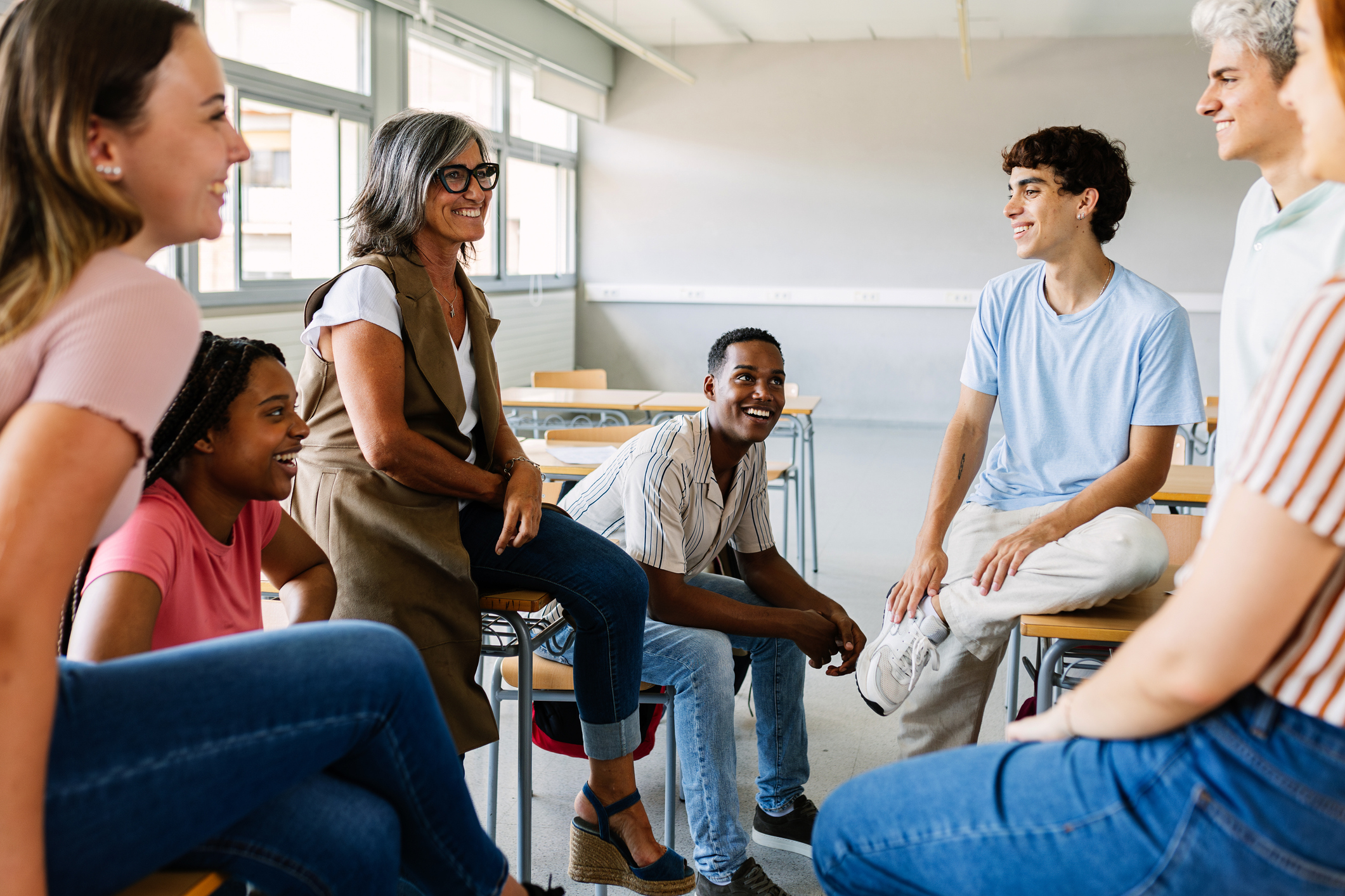 students sit in a circle talking